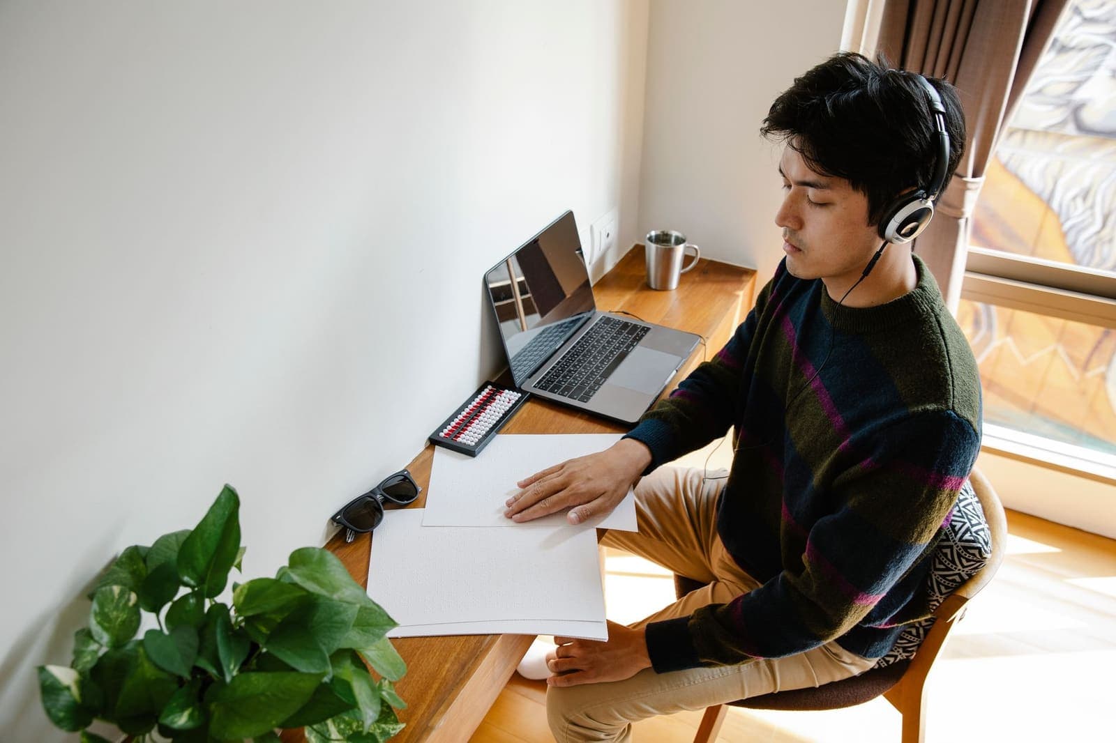 Person working at a tidy desk with a single focused task visible on screen