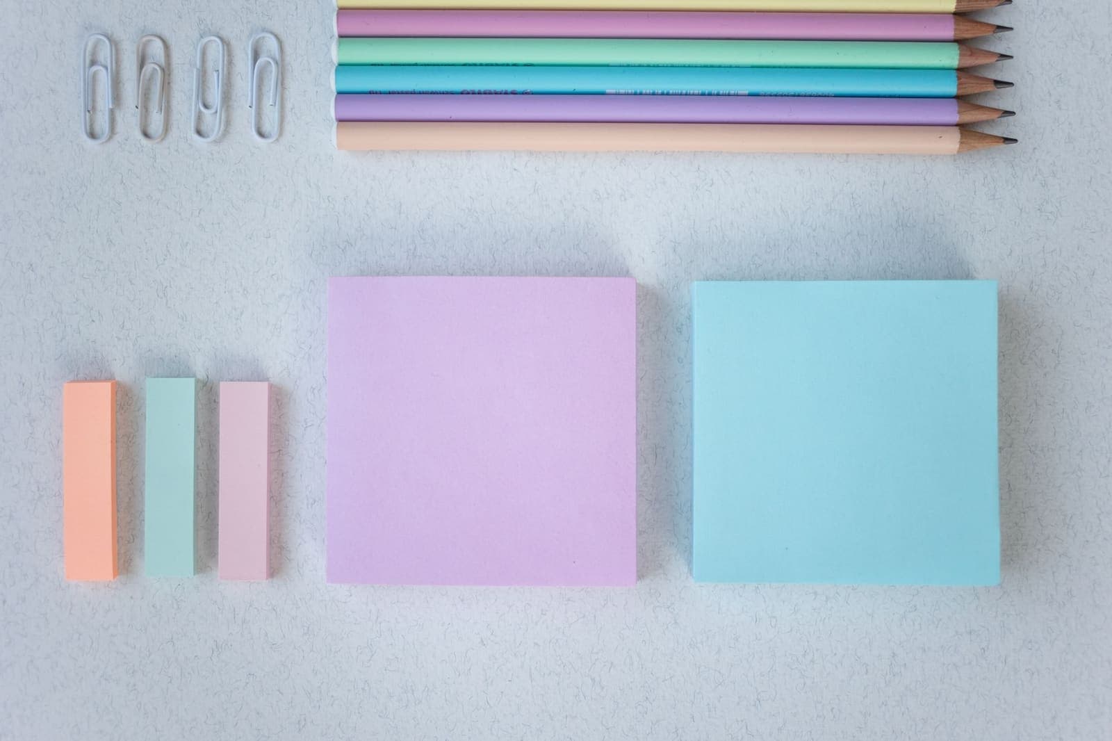 Colorful sticky notes organized into groups on a desk surface