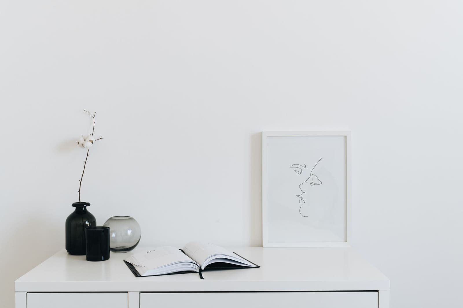 A calm minimal desk with a notebook and coffee cup representing setting boundaries at work