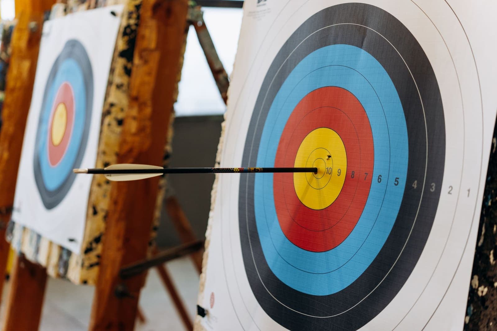 Arrow hitting the bullseye of a target, representing goal setting and achievement