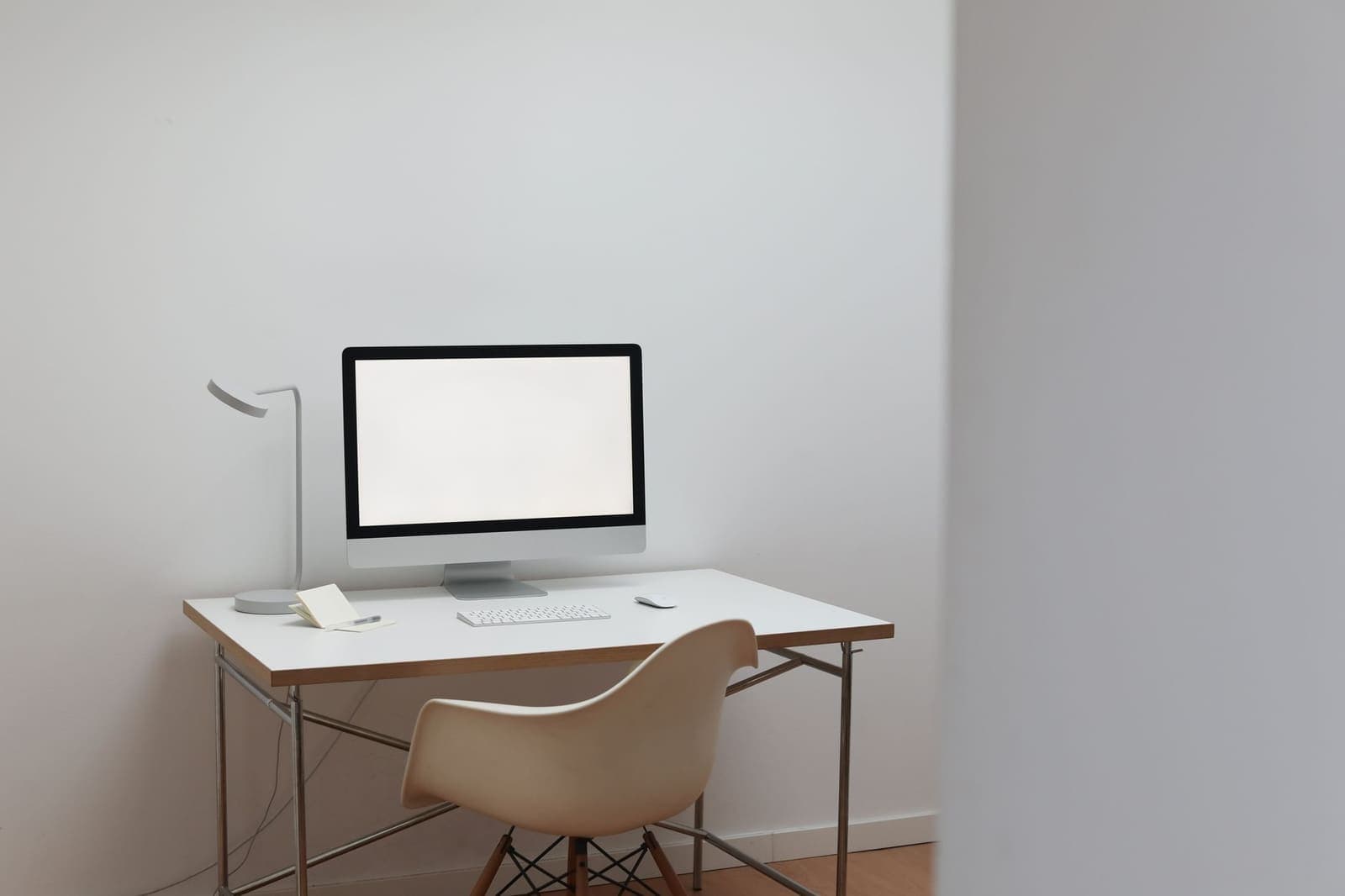 A single pen resting on a clean minimal desk, representing focused single-tasking